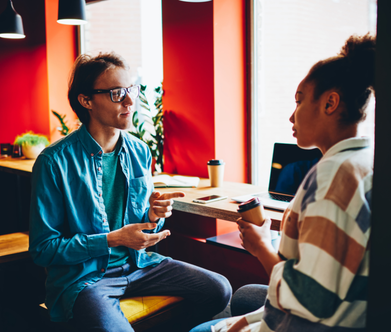 Image of two people talking